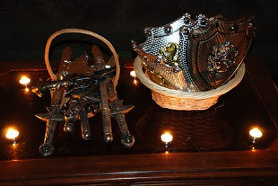 swords and shields in candlelight