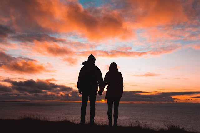 Couple holding hands. Love prevails.