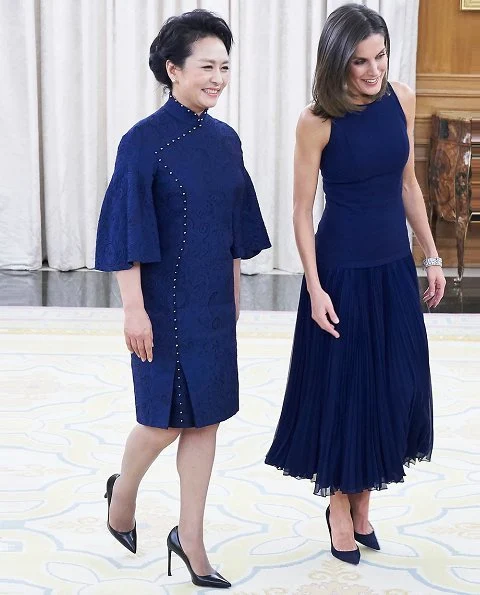 Queen Letizia wore Felipe Varela skirt and top and Nina Ricci pumps. Peng Liyuan. Queen Victoria Eugenia's Cartier diamond earrings
