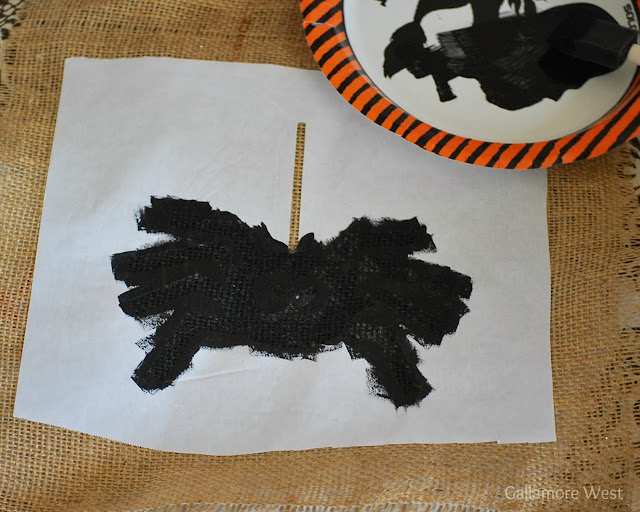 painted spider template black on flag