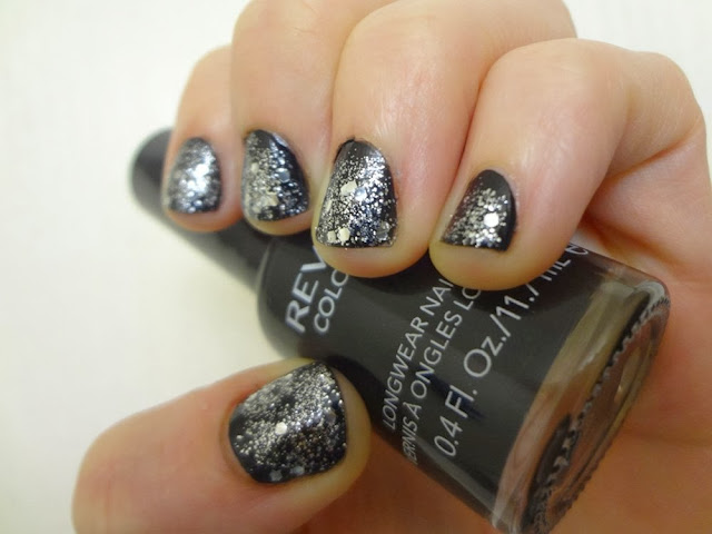 Revlon Stiletto black nail polish with silver glitter polish on top of it.