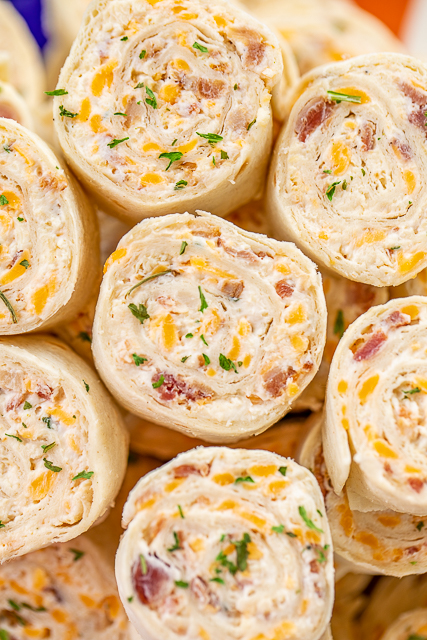 Crack Chicken Pinwheels - I am ADDICTED to these sandwiches! Cream cheese, cheddar, bacon, ranch and chicken wrapped in a tortilla. So simple to make with rotisserie chicken and precooked bacon. Can make ahead of time and refrigerate until ready to eat. Perfect for parties and tailgating!! #pinwheels #chicken #tailgating #bacon #sandwich #partyfood Crack Chicken Pinwheels - I am ADDICTED to these sandwiches! Cream cheese, cheddar, bacon, ranch and chicken wrapped in a tortilla. So simple to make with rotisserie chicken and precooked bacon. Can make ahead of time and refrigerate until ready to eat. Perfect for parties and tailgating!! #pinwheels #chicken #tailgating #bacon #sandwich #partyfood