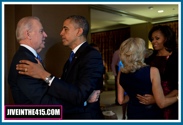 Obama and Biden embrace with their wives while watching election retuyrns in Chicago 11/06/2012.