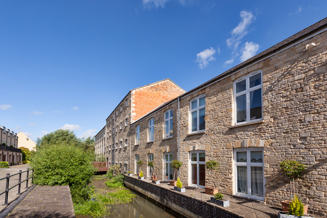 Old mill buildings now serve as residential apartments in Witney by Martyn Ferry Photography