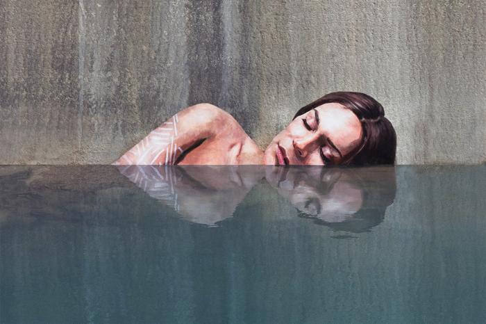 Artist Paints Murals of Women While Floating on a Surfboard Artist Paints Murals of Women While Floating on a Surfboard