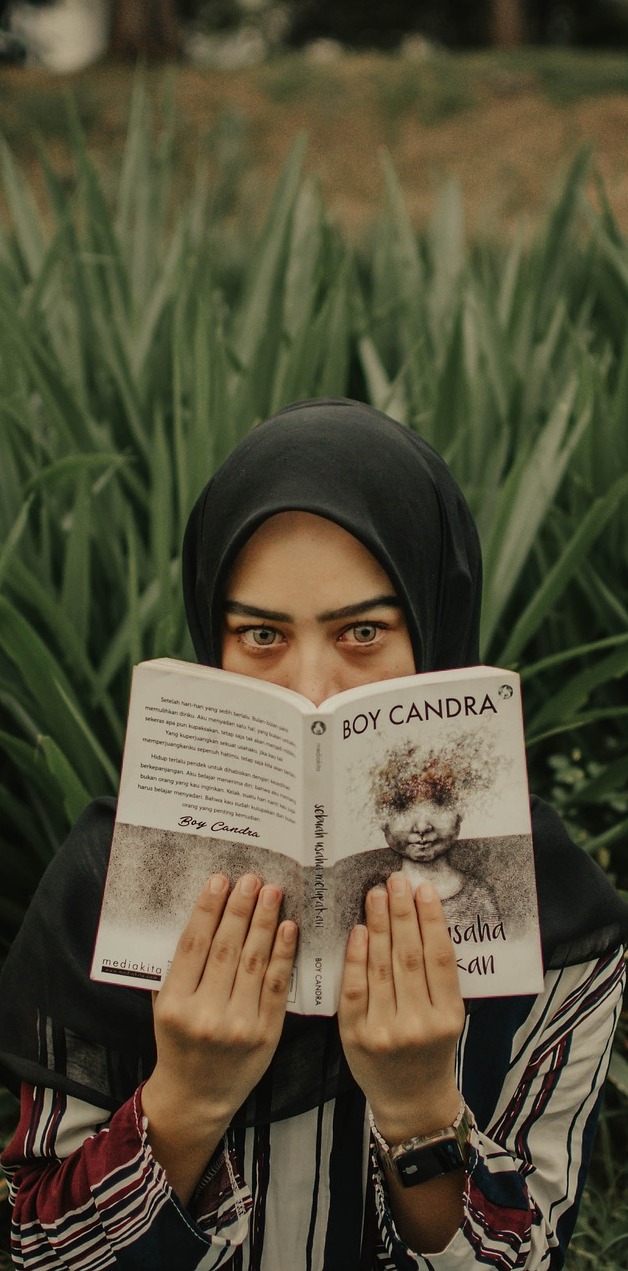 A girl reading. A girl reading.