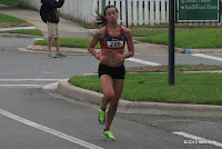 First female finisher #709 Jess Butler (8th, 18:24). Jess Butler