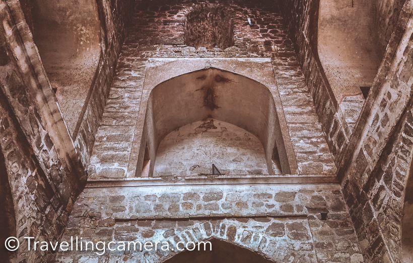 When loitering around in Cannaught Place or navigating traffic on Barakhamba Road, it is difficult imagine that barely 5-minutes away, hidden amongst trees, lies the magnificient stone structure of Agrasen ki baoli. The 14th-century step well was restored by the Archaeological Survey of India in the year 2002. Now the Baoli is clean and well-maintained. We visited Agrasen ki Baoli on a humid Sunday afternoon and were expecting to find a more or less abandoned structure with may be a couple of people loitering about here and there. But we were in for a surprise. The baoli was buzzing with well-dressed, pouting, selfie-clicking youngsters. They were there in such large numbers that it was difficult to capture even a single shot without people in it. This was heartening. I don't know whether this popularity is because the Baoli was recently featured in the popular Bollywood film PK or because the Baoli is clean, litter-free and situated barely a kilometre away from the heart of the city. It may be all of these, but it is wonderful to see the hard work of the ASI bearing fruit. Usually when we head out to explore the city, we make sure that we carry a DSLR and all the required lenses, but this time we had decided to do something different. The impact of camera phones on the photography ecosystem is the hot topic for debate nowadays, and we decided to settle it with a practical. So this time instead of a DSLR, we were carrying a smartphone - Honor 5c to be precise. All the pictures that you are seeing in this post have been clicked using Honor 5c. Based on the results, we can comfortably say that for everyday non-professional use, a smartphone, if used well, can suffice. One would of course need to study all the capabilities and features of the particular smartphone camera in details to be able to use them in appropriate situations. Coming back to the Baoli, we captured the structure, the pigeons peeping out of the gaps in the walls, the contrast between the modern skyscrapers of CP and the medieval architecture of the Baoli, the people exploring the structure and a lot more. The baoli is situated in one of the lanes branching out of the very pretty Hailey road, and this lane is dotted with some very interesting grafitti. We captured some of that too. If you haven't yet seen Agrasen ki Baoli, we recommend that you should. But make sure that the day is pleasant and you have time on your hands, because there is a lot to take in at the Baoli and in the surroundings.    