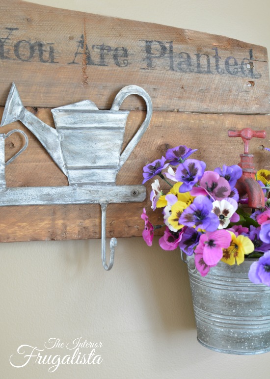 A rustic wall mount Garden Tool Holder With Flower Planter. Unique small garden tool organization for the backyard garden shed or potting bench.