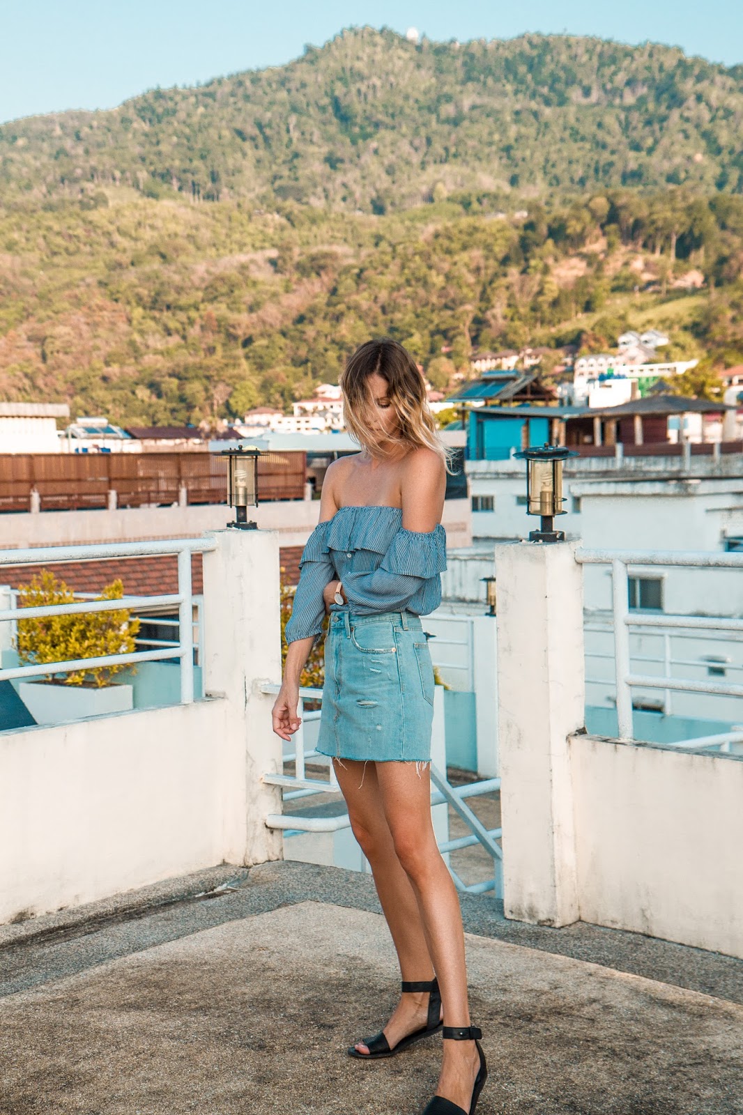 fashion and travel blogger, Alison Hutchinson, in Phuket Thailand, wearing a Faithfull the Brand off the shoulder top and Levi's deconstructed denim skirt