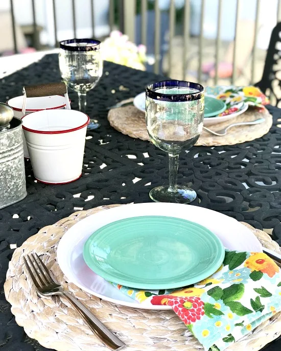 Beautiful outdoor lunch table with recycled glass vase