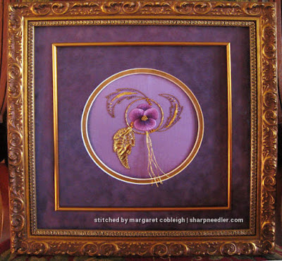 Completed embroidery framed. (Royal School of Needlework, goldwork with pansy)