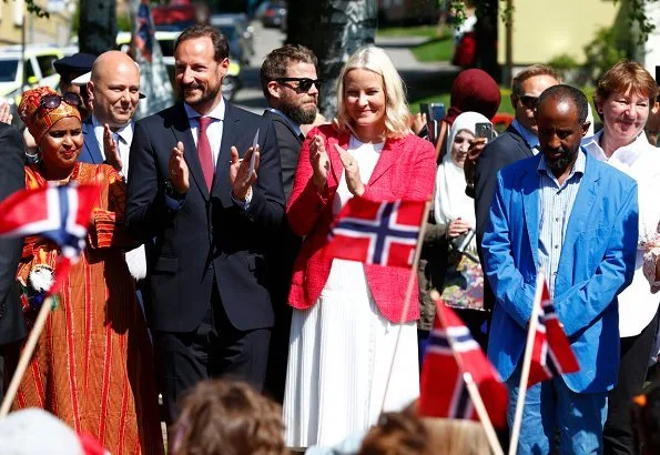 Crown Princess Mette-Marit wore a new Altuzarra skirt with her Prada red jacket and Yvonne Koné suede pumps. The Crown Couple visited Sagene Church