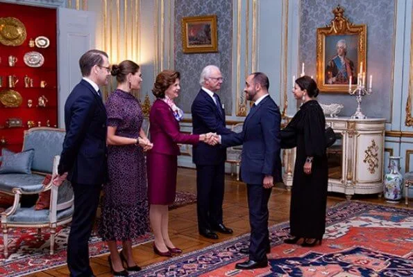 Crown Princess Victoria wore By Malina Lysandra dress. Queen Silvia wore burgundy satin suit