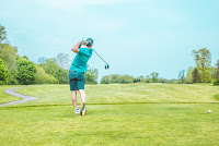 golfer taking a swing golfer taking a swing