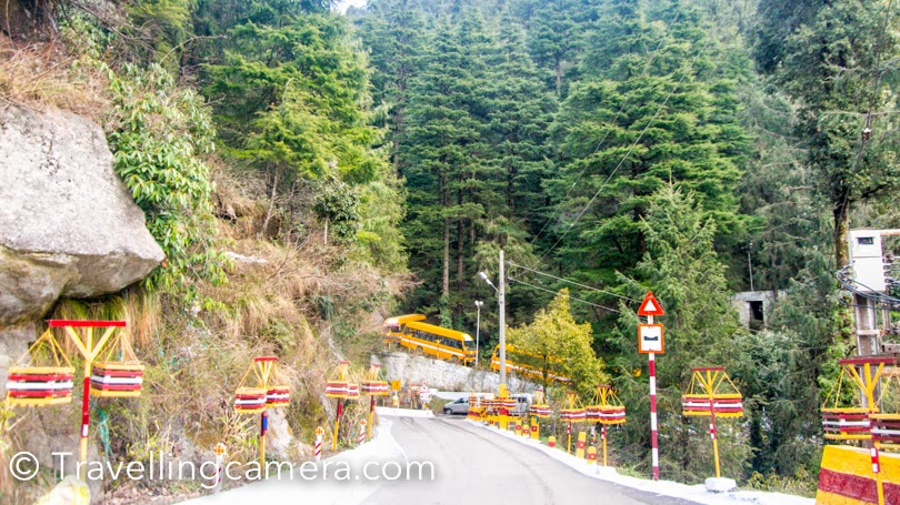 I have been to Dalhousie many times and during last visit, I and Vibha planned to walk around Dalhousie Public School. This beautiful School is located on a huge hill on the road which connected Dalhousie with Khajjiar. This PHOTO JOURNEY shares some photographs of Dalhousie Public School in Himachal Pradesh. Above photograph gives a quick glimpse of the campus, but it's not the whole thing. Dalhousie Public School is spread over two hills around the town. This is one of the most popular boarding schools in Himachal Pradesh.Lot of kids from various parts of the country and abroad come here for studies. It definitely a great place to study and have fun around snow covered hills. It's quite peaceful place and weather is just awesome. When cities like Delhi are hot with 40-45 degrees, these kids wear their jackets in Dalhouise. Instead of Summer vacations, the school is closed for 2 months during winters. Dalhousie Public School has recently started 11th and 12th classes as well. Earlier it was a high school. This was unbelievable. A MIG is installed in the campus of Dalhousie Public School. I don't know much about why and how, but it really sounds interesting :). We were staying in the house you see in above photograph and we wanted to come to this place to ensure that it's real and not a model. Walking up till the student hotels, we realized that even 5 year old kids are also staying here without their parents. This was hard to imagine for us, but it seems that they enjoy being here with their friends and caring staff. Above photograph shows the main campus of the school with all offices and class-rooms. This is first building you see when coming from Dalhousie Town towards Khajjiar. There is approximately 1 km stretch of Dalhousie-Khajjiar road, which is beautifully maintained by Dalhousie Public School. Due to snowfall all the flowering plants had died but staff was actively working to make these pot happy with new plants. Principal's residence @ Dalhousie Public School. Like the whole campus of the school, residences of teachers and principal was quite nice. Here is a view of Ravi river from Teacher's residences. Ravi  river looks stunning on a sunny day. The day we visited Dalhouise, it was rainy and cloudy.