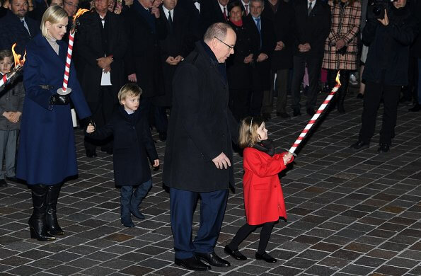 Prince Albert, Princess Charlene, Princess Gabriella and Prince Jacques attended Saint Devota event. royal blue cahmere wool coat