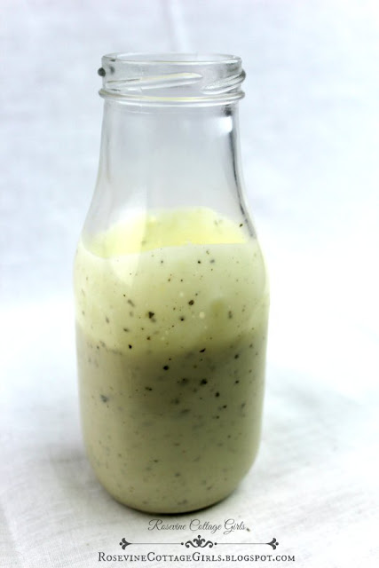 a glass bottle with homemade ranch dressing | Ranch Dressing Recipe | rosevinecottagegirls.com | salad dressing