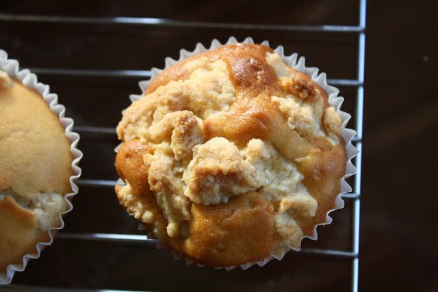 Top down shot of apple streusel muffins on a wire baking rack.