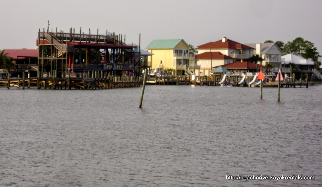 Tacky Jacks in Orange Beach now offers an opportunity to rent kayaks. As you can see you will paddle in big, open waters popular to boaters.