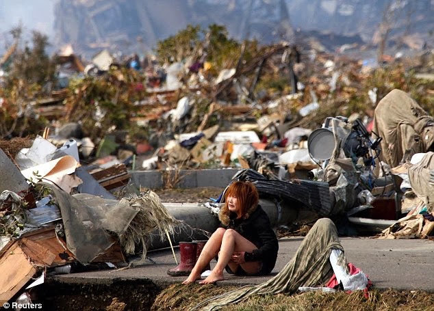 Girl devastated after the tsunami that hit Japan in 2011.