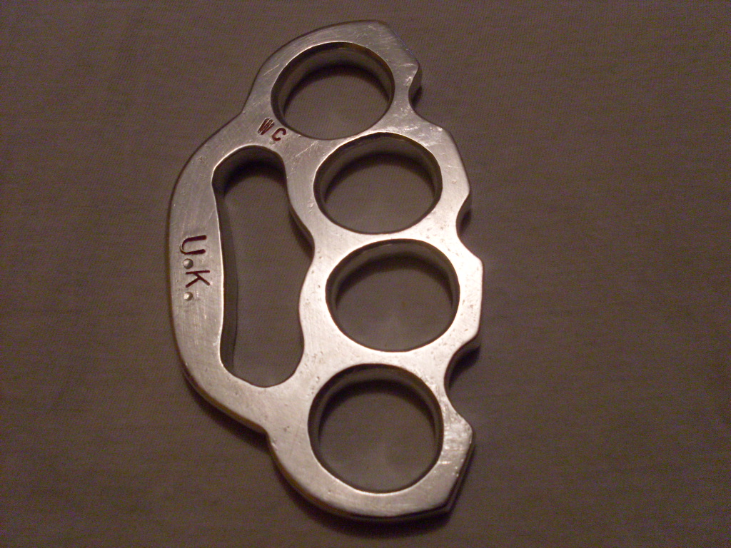average size four finger knuckle duster / brass knuckles with flat striking...