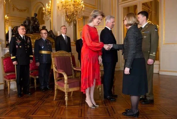Queen Mathilde wore Natan silk print dress. Queen Mathilde wore a red silk midi dress by Natan. gold earrings