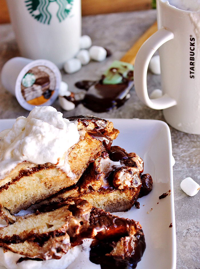 Thick Challah bread slices slathered in homemade chocolate Ganache, sandwiched with miniature marshmallows, and soaked in a rich Starbucks Salted Caramel Hot Cocoa egg wash. Pure heaven. Enjoy this delicious Hot Chocolate French Toast alongside a mug of Starbucks #HotCocoa #Kcup varieties. #IC (ad)