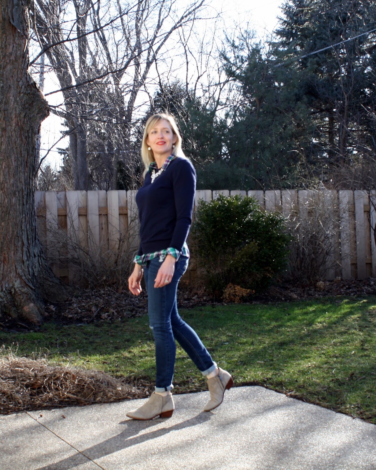 navy pullover sweater + plaid button-up and statement necklace