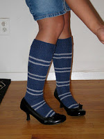 These blue and silver Ravenclaw knee highs, using the small repeated striping of the later Hogwarts years could easily be knit in any of the four Hogwarts School Colors.