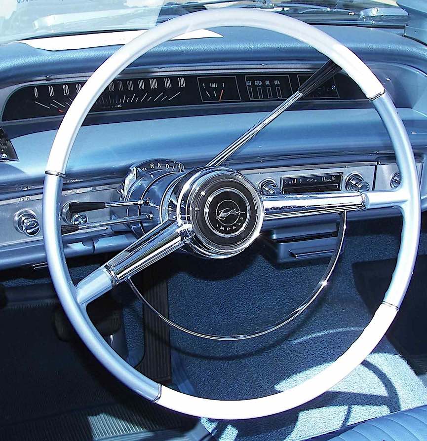 a blue 1964 Impala dashboard with a convertible rooftop