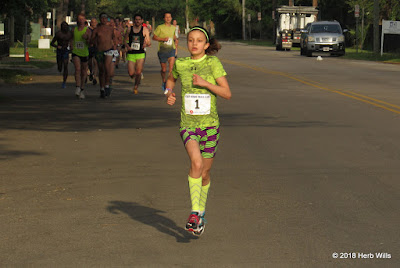 Three-time Palace Saloon 5K women's champ #1 Ani Veltcheva (13th, 18:05) racing comfortably near the 2K mark of the 2018 race Ani Veltcheva