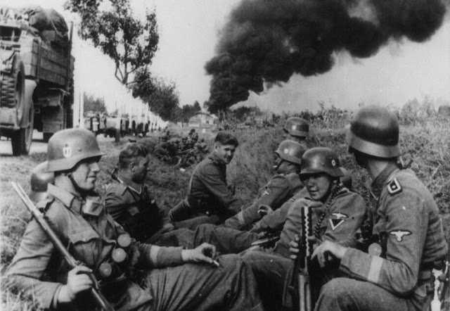 Soldiers of the SS-Leibstandarte Adolf Hitler Division, resting in a ditch alongside a road on the way to Pabianice, during the invasion of Poland in 1939.