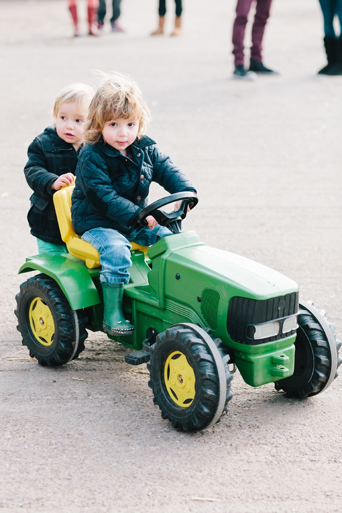 adorable little boys at the farm on a tractor photo by STUDIO 1208
