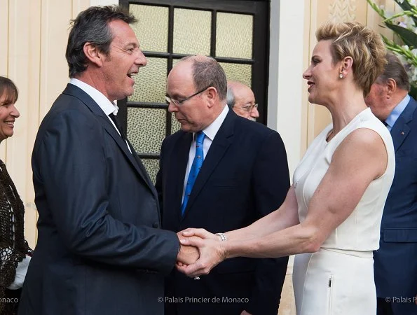 Prince Albert and Princess Charlene held a reception for 75th Monaco Grand Prix Formula 1 at Principality Palace. Princess wore Akris Pantsuit