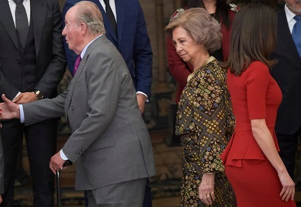 Queen Letizia wore Carolina Herrera red peplum stretch wool dress and Carolina Herrera clutch. Queen Sofia and Infanta Elena