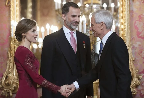 Queen Letizia attends the annual Foreign Ambassadors reception at the Royal Palace. Queen Letizia wore Felipe Varela Long sleeve dress in red diamond earrings