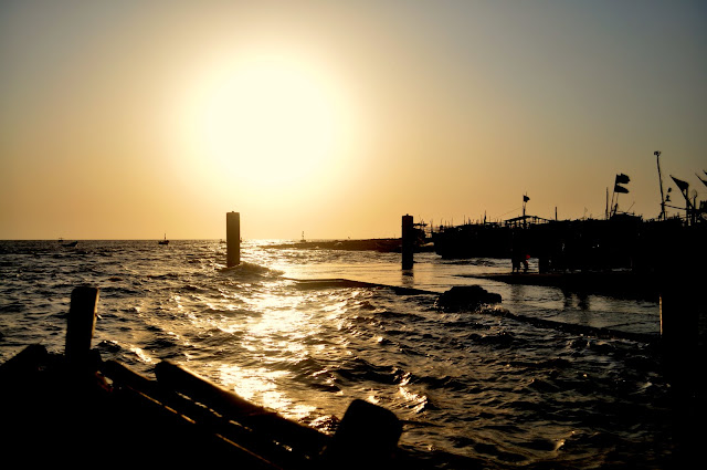 Daman Travel Tourism Gujarat Daman sea Gujarat Travel Tourism Guide boats sunset golden light