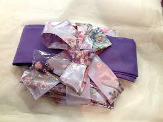 Kimono wrapped up as a gift with obi from Kimono House NY