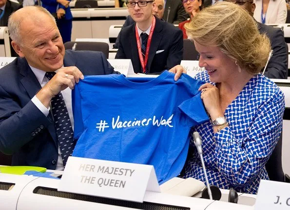 Queen Mathilde's outfit was by Dries Van Noten. European Commission President Jean Claude Juncker