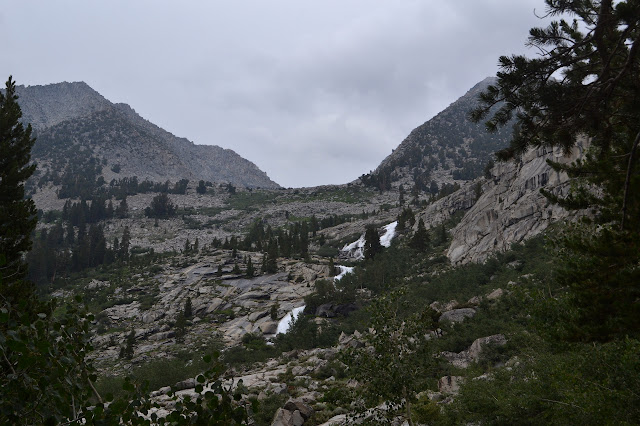 white water pouring over more rocks where the trail is heading