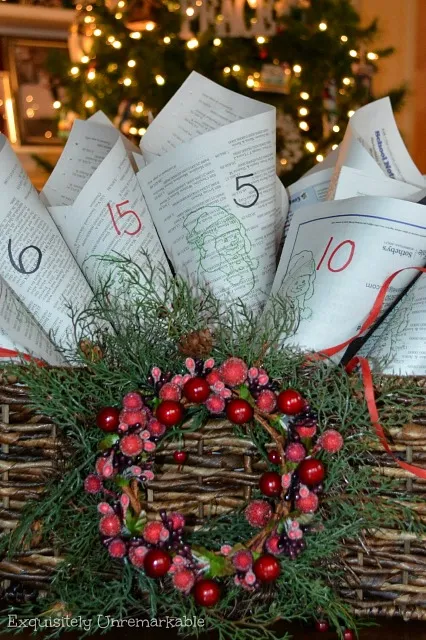 Newspaper Cone Advent Calendar in basket with red wreath on front