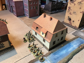 The Candian infantry seek refuge in a building