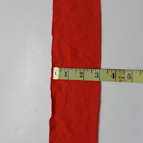 cutting a fabric strip for sewing flowers