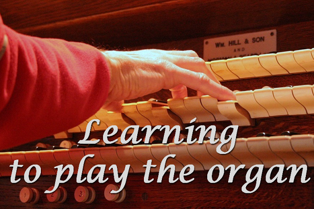 Organ with three manuals (ie keypads) and four stops being played 