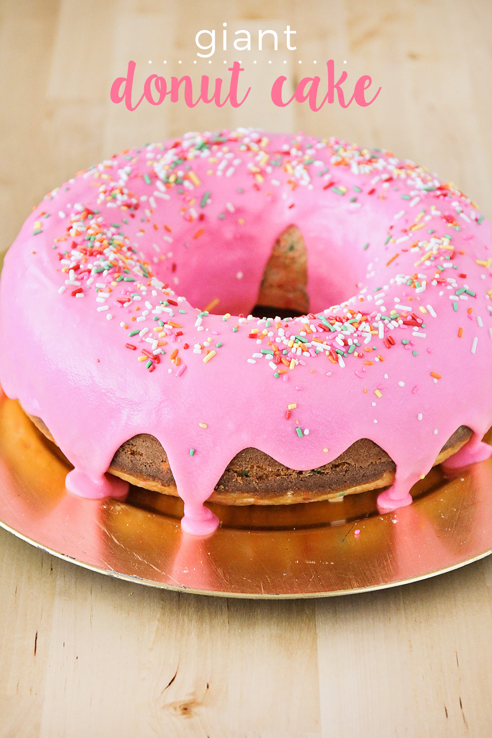 This giant donut cake is super easy to make, and so fun, too! Perfect for birthdays and special occasions!