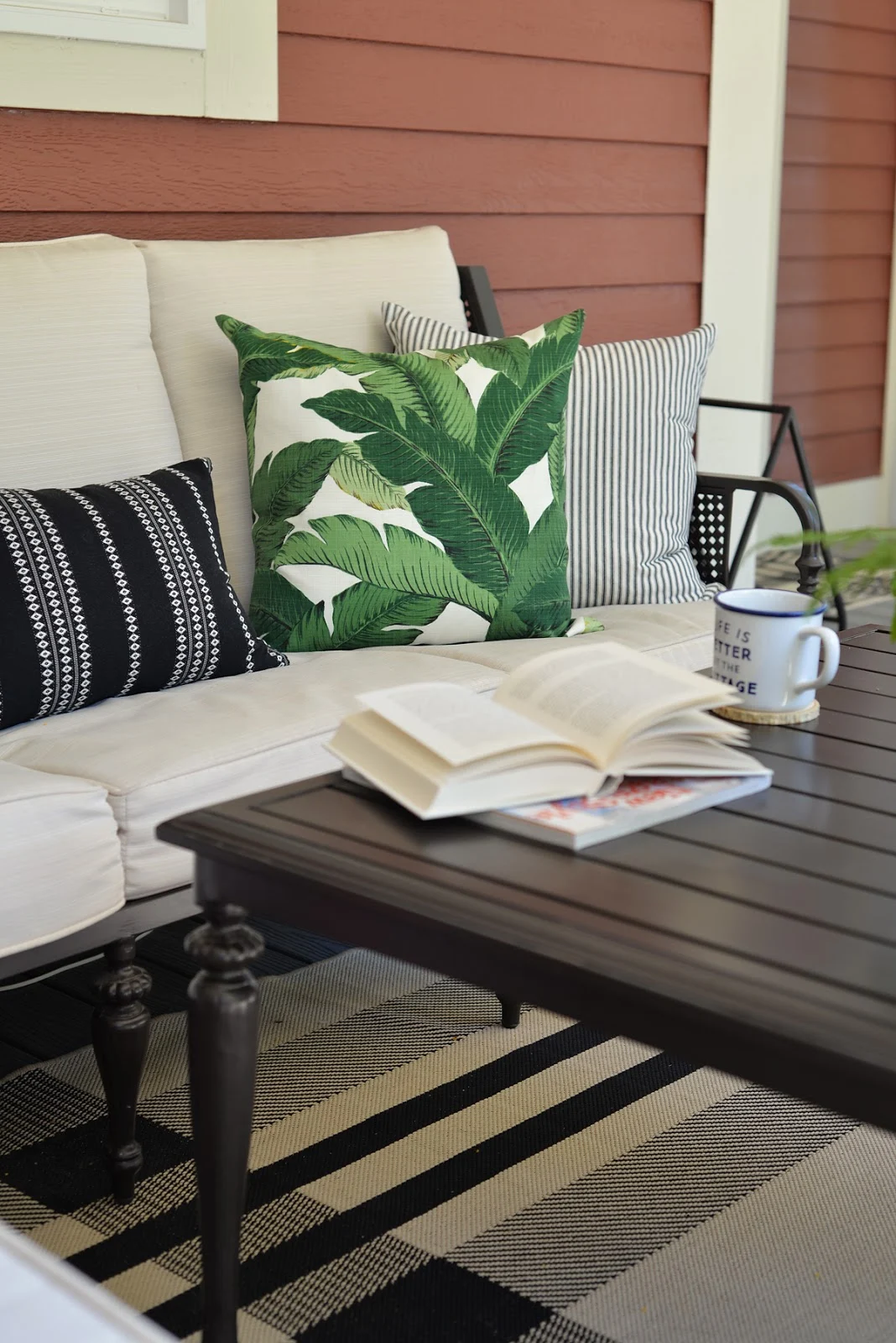 RamblingRenovators.ca | porch decor | British Colonial outdoor furniture, ticking stripe, palm leaves