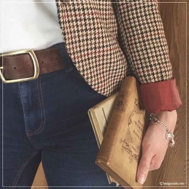 Tweed-Jacket-and-Jeans-with-Brown-Leather-Belt-Holding-Vintage-Books