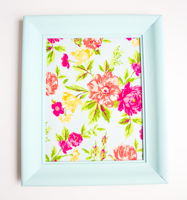 Such a fun thrift store makeover! Transform an old picture frame into this colorful Hello Spring fabric art! Such a fun thrift store makeover! Transform an old picture frame into this colorful Hello Spring fabric art!