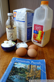 image of ingredients needed to make Finnish Oven Pancake with eggnog, plus the recipe book which inspired this recipe